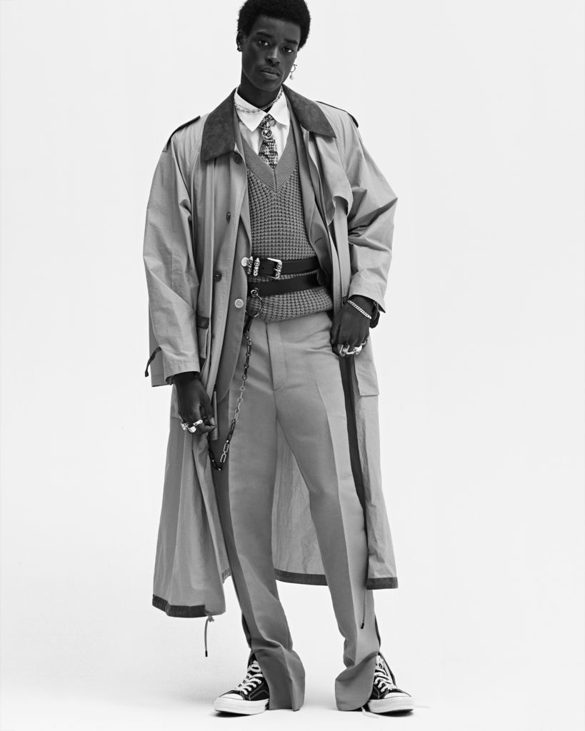  Babacar wears coat, jacket, sweater, shirt, tie, pants Fendi; Shoes Converse; Necklace (worn over collar, bottom), belt (top), rings (right ring and pinky fingers) Chrome Hearts Earring (his left, throughout) and belt (bottom, worn multiple times throughout) Givenchy Ring (right middle finger, worn throughout) Balenciaga Ring (right index finger) Ambush Ring (left index finger) Alexander McQueen Necklace (worn over collar, top), earring (his right, throughout), bracelet (worn multiple times throughout), ring (left pinky finger) Saskia Diez; Necklace (worn under collar) stylist's own, Rings (left middle and ring fingers) model's own