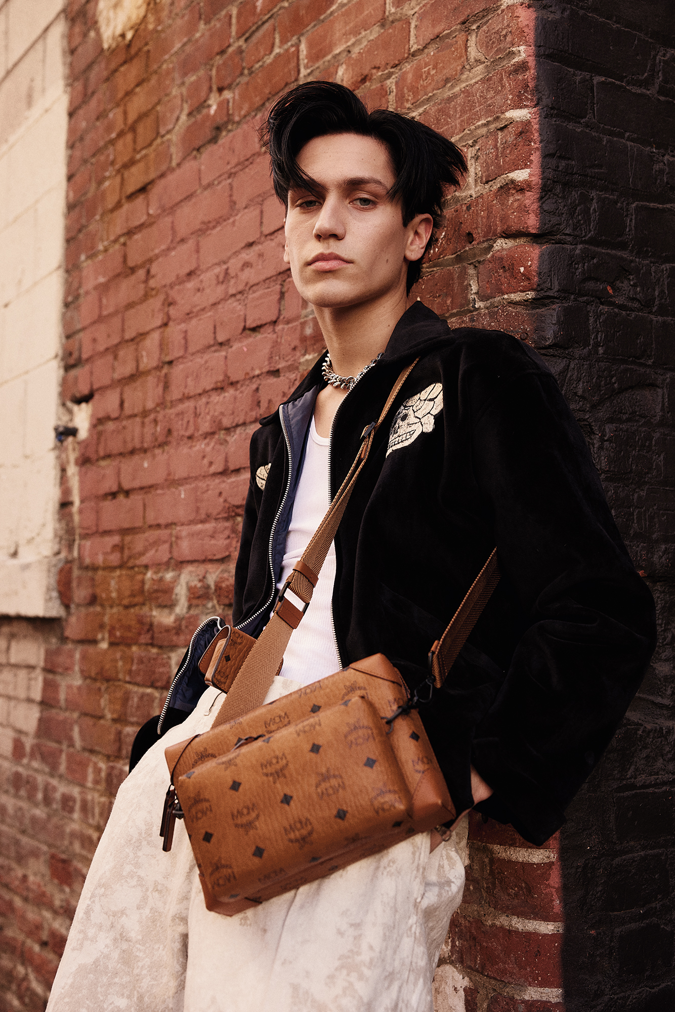 Huddy wears pants Our Legacy Bag MCM Jacket vintage, stylist’s own Tank top stylist’s own Jewelry his own On hair OUAI Matte Pomade
